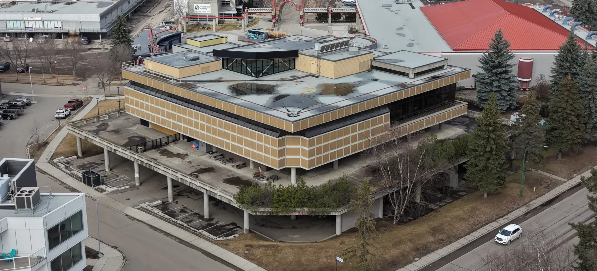 Drone photo of the library and its raised concrete podium, March 2026