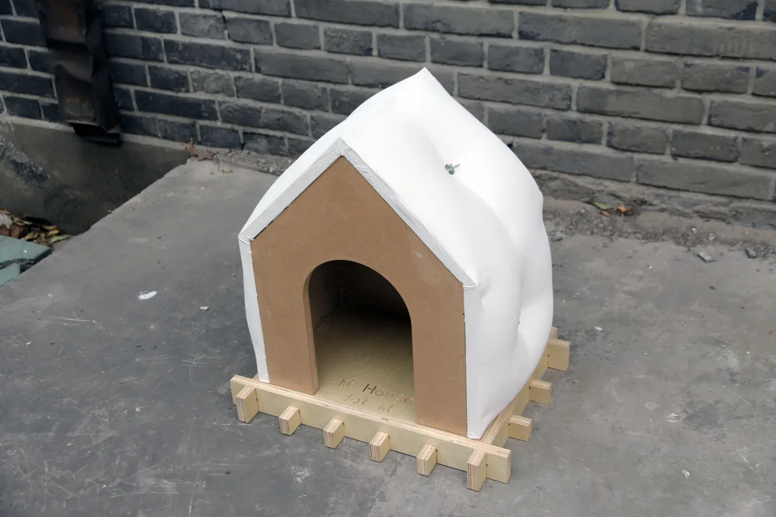 Early prototype with a quilted roof on a slatted base