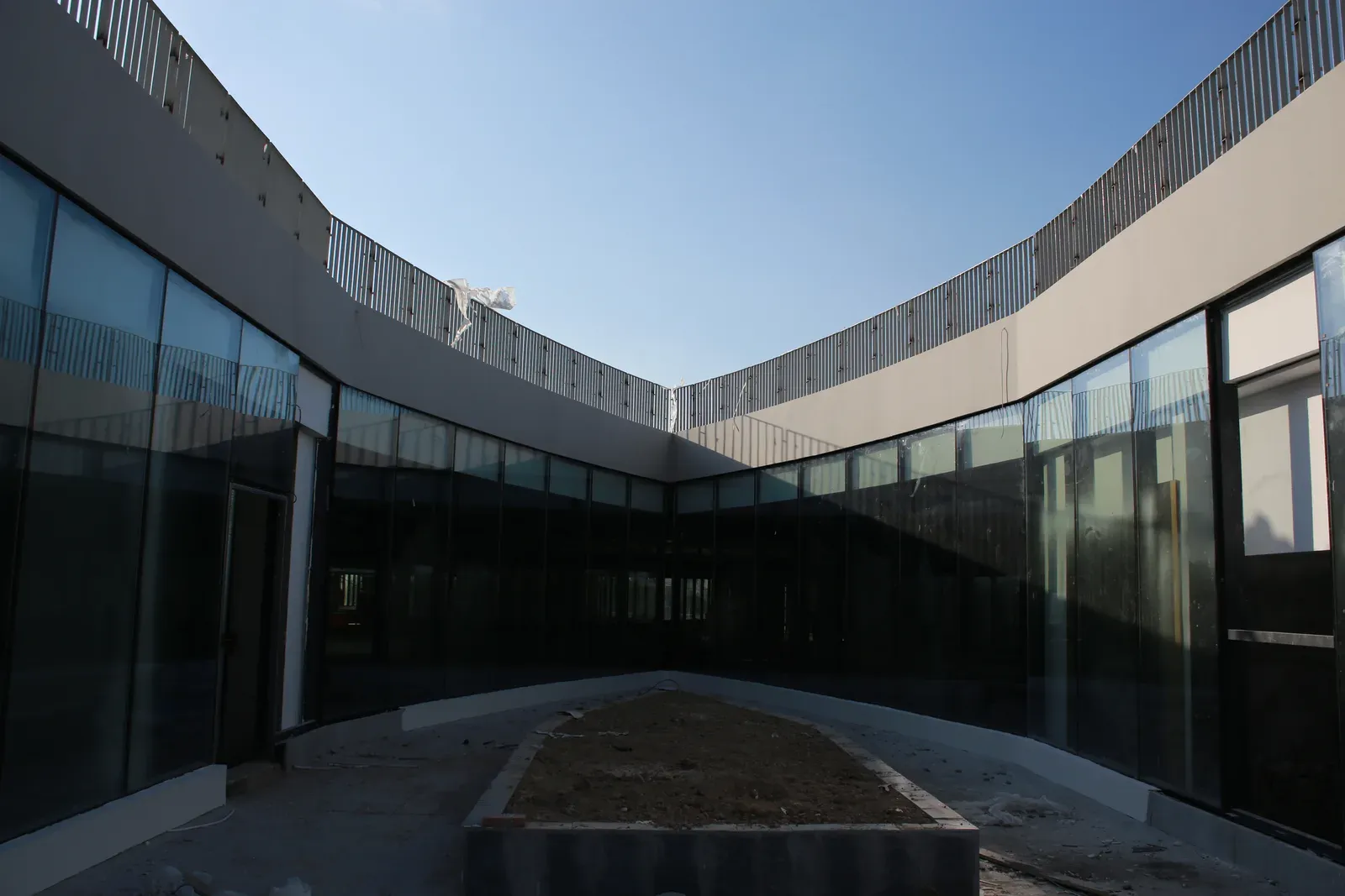 Curved glazed courtyard during construction